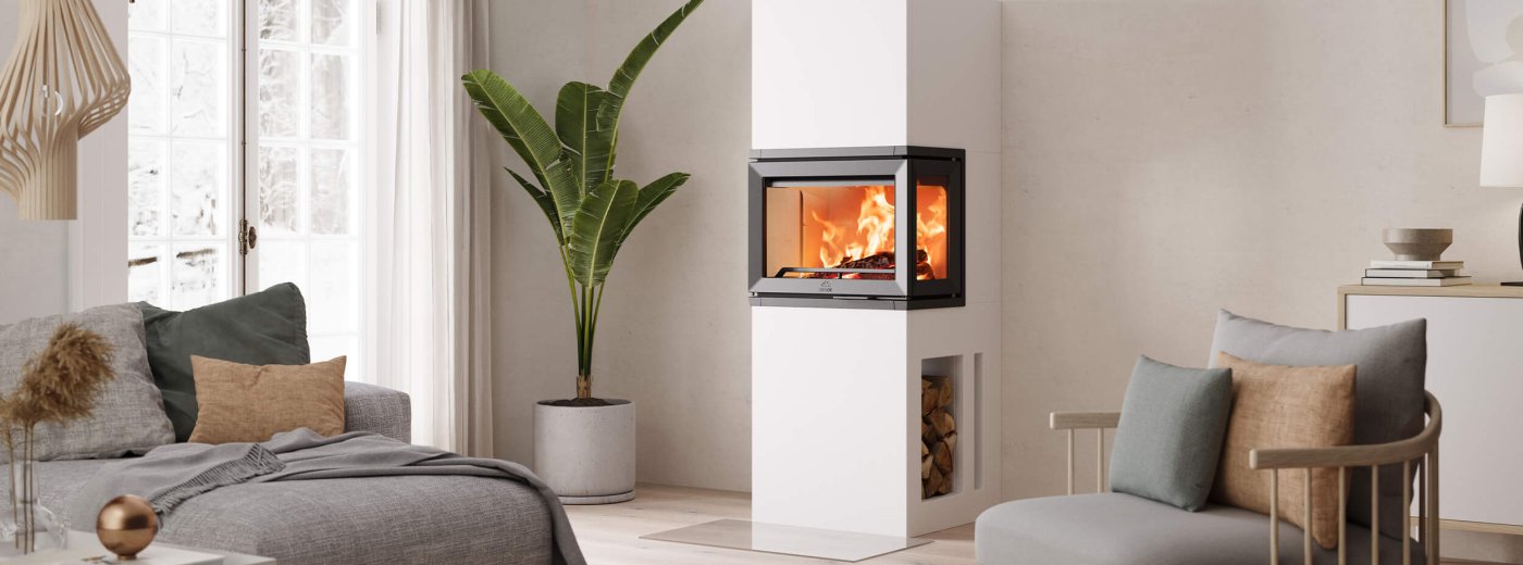 Biały kominek Jøtul FS 520 FRL w jasnym, nowoczesnym skandynawskim salonie